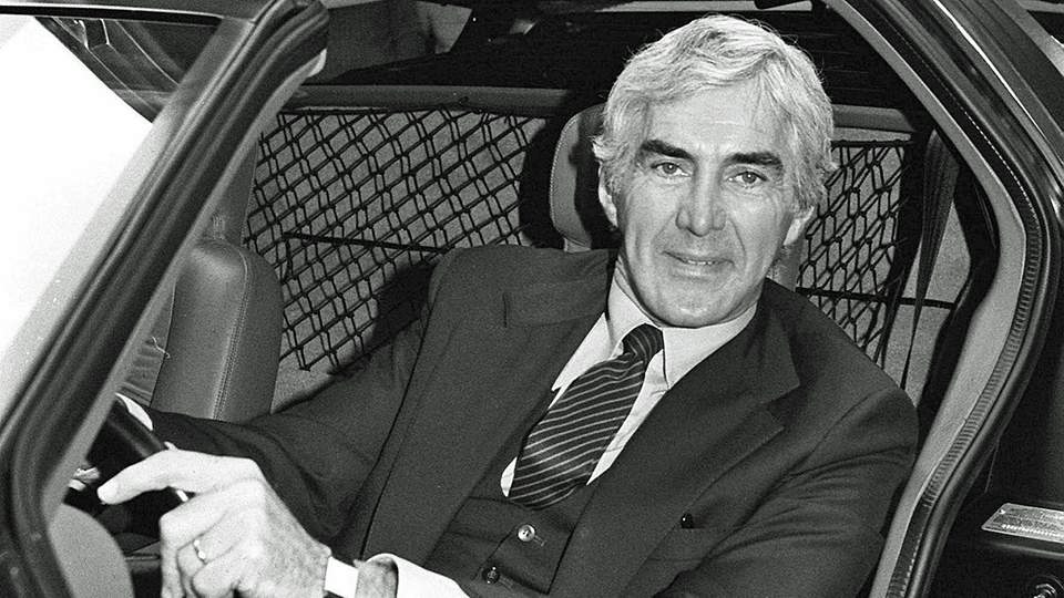 John Delorean in his car